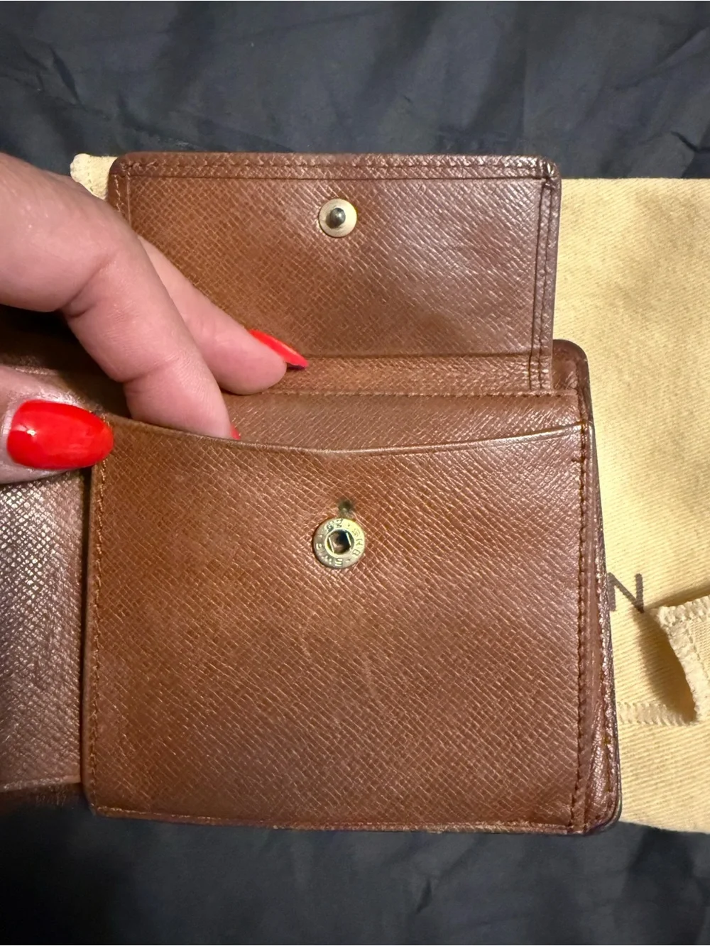 Louis Vuitton authentic Monogram Canvas Bi-Fold Wallet in Brown and Tan